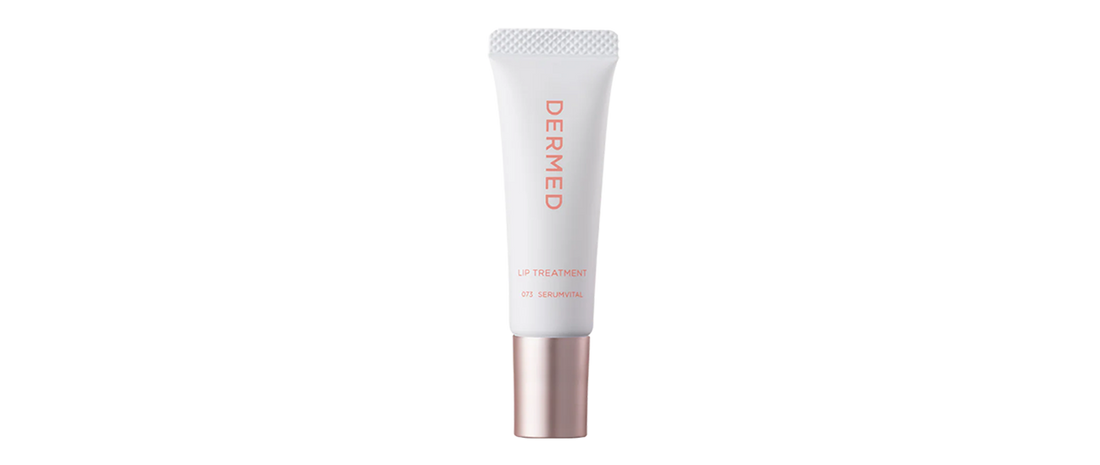 White tube of DERMed Lip Treatment with a silver and rose gold cap.